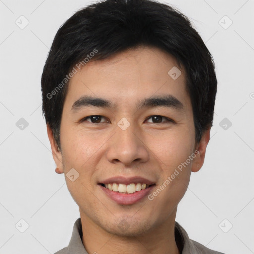 Joyful asian young-adult male with short  black hair and brown eyes