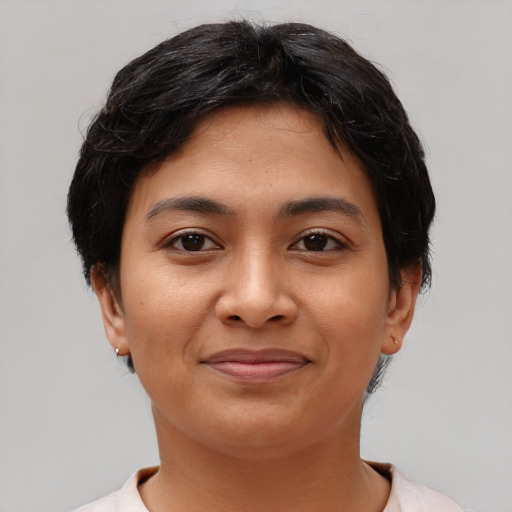 Joyful latino young-adult female with short  brown hair and brown eyes