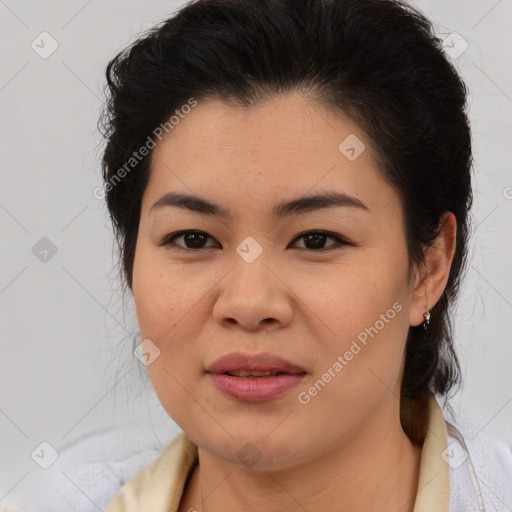 Joyful latino young-adult female with medium  brown hair and brown eyes