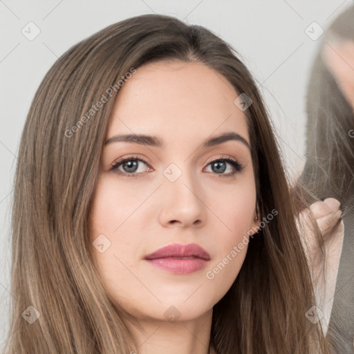 Neutral white young-adult female with long  brown hair and brown eyes