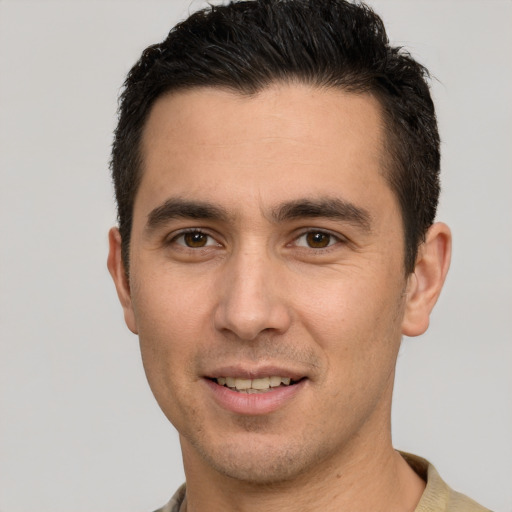 Joyful white young-adult male with short  brown hair and brown eyes