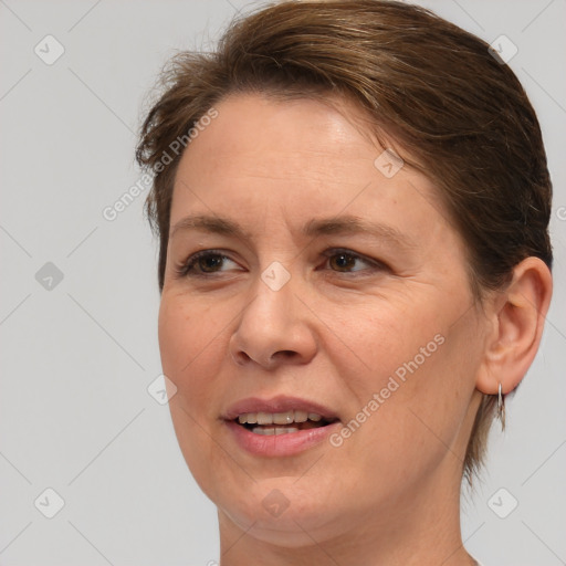 Joyful white adult female with medium  brown hair and brown eyes