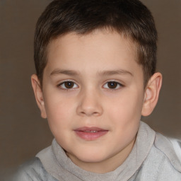 Joyful white child male with short  brown hair and brown eyes