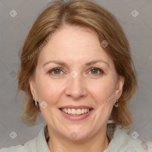 Joyful white adult female with medium  brown hair and blue eyes