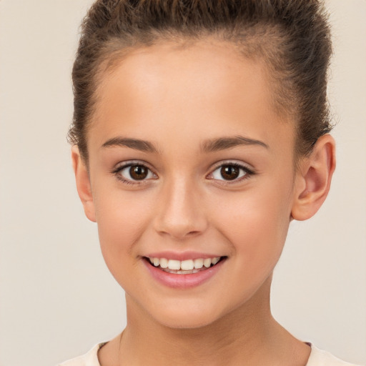 Joyful white child female with short  brown hair and brown eyes