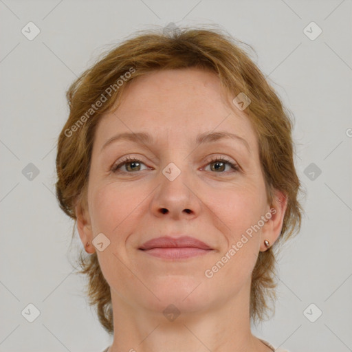 Joyful white adult female with medium  brown hair and grey eyes