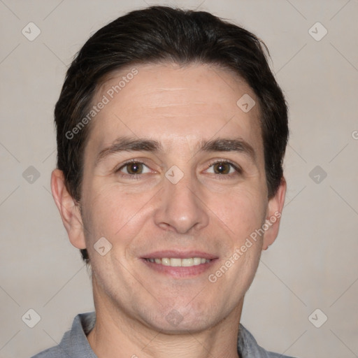 Joyful white adult male with short  brown hair and grey eyes