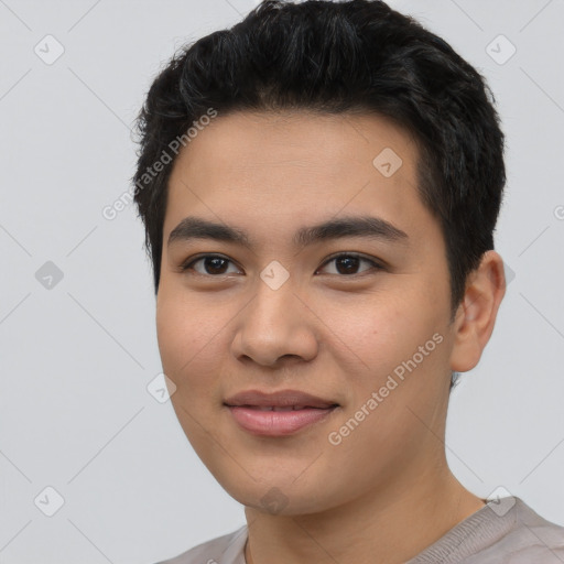 Joyful asian young-adult male with short  black hair and brown eyes