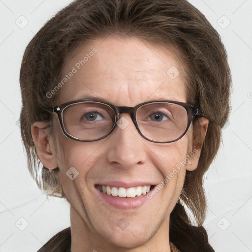 Joyful white adult female with medium  brown hair and blue eyes