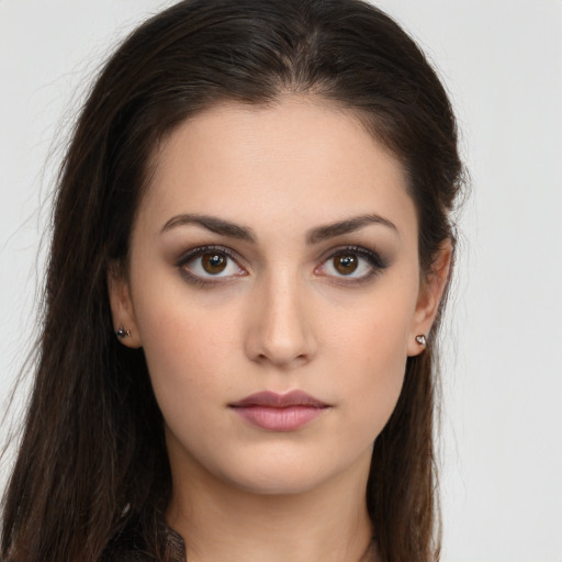 Neutral white young-adult female with long  brown hair and brown eyes