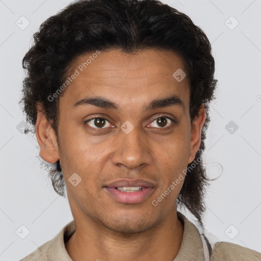 Joyful latino young-adult male with short  brown hair and brown eyes