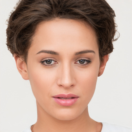 Neutral white young-adult female with short  brown hair and brown eyes