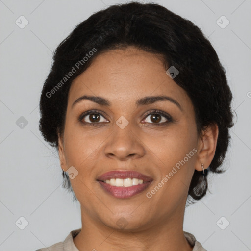 Joyful latino adult female with medium  brown hair and brown eyes