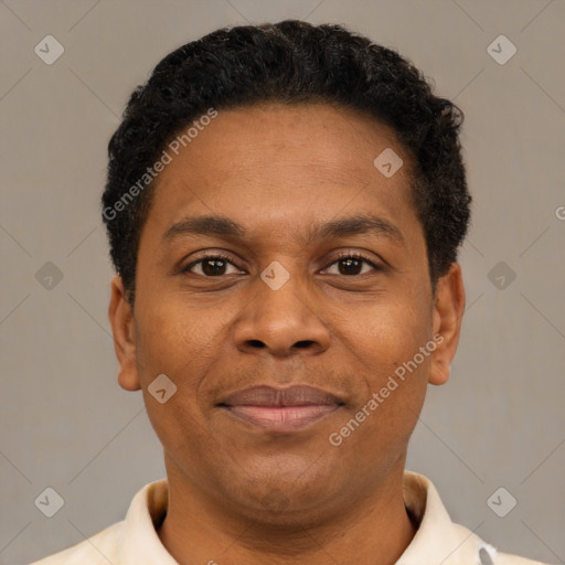Joyful latino young-adult male with short  brown hair and brown eyes