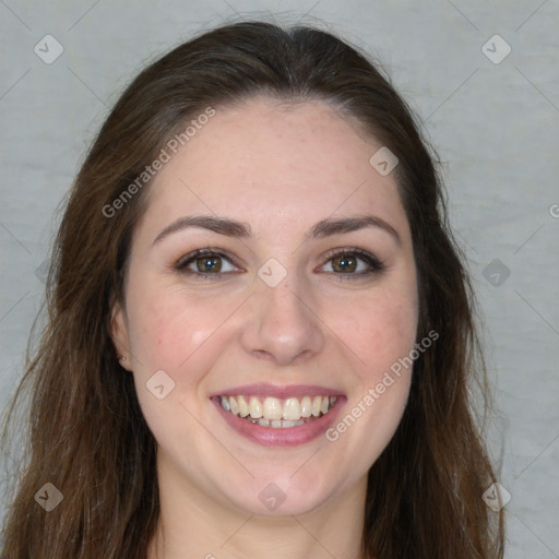 Joyful white young-adult female with long  brown hair and green eyes