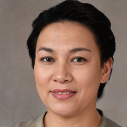 Joyful asian young-adult female with short  black hair and brown eyes