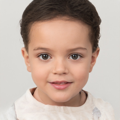 Joyful white child female with short  brown hair and brown eyes