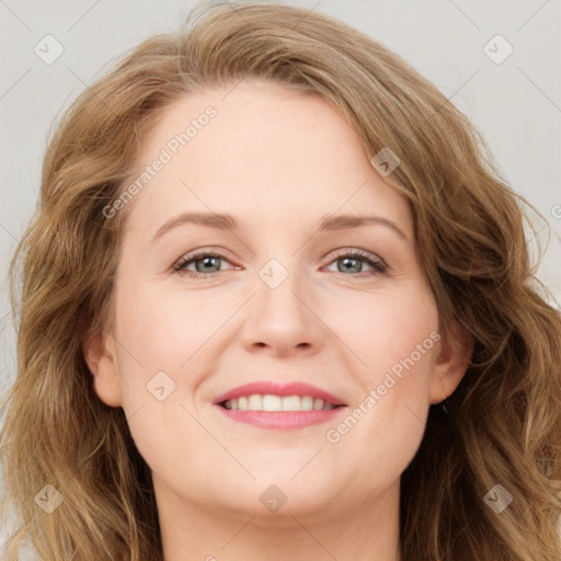 Joyful white young-adult female with long  brown hair and green eyes