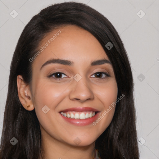 Joyful latino young-adult female with long  black hair and brown eyes