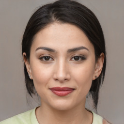 Joyful white young-adult female with medium  brown hair and brown eyes