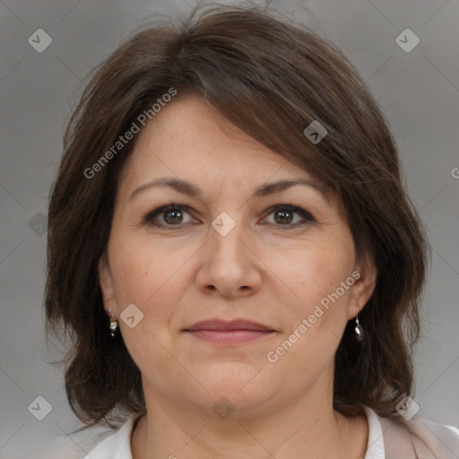 Joyful white adult female with medium  brown hair and brown eyes