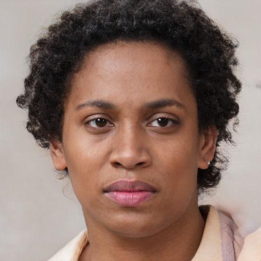 Neutral black young-adult female with short  brown hair and brown eyes