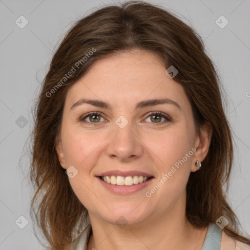 Joyful white young-adult female with medium  brown hair and green eyes