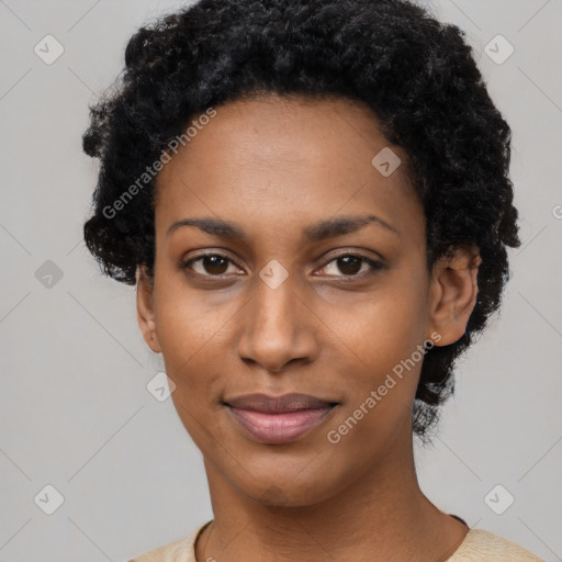 Joyful black young-adult female with short  black hair and brown eyes