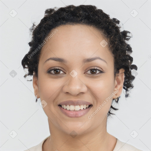 Joyful black young-adult female with short  brown hair and brown eyes