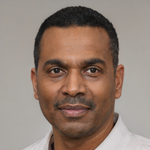 Neutral latino adult male with short  black hair and brown eyes