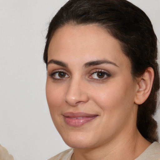 Joyful white young-adult female with medium  brown hair and brown eyes