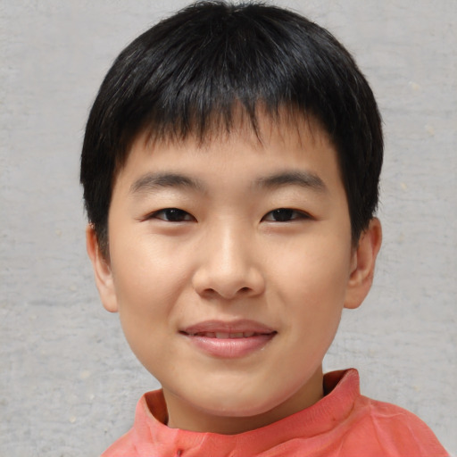 Joyful asian child male with short  brown hair and brown eyes