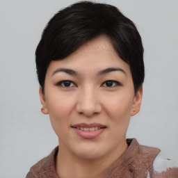 Joyful asian young-adult female with short  black hair and brown eyes