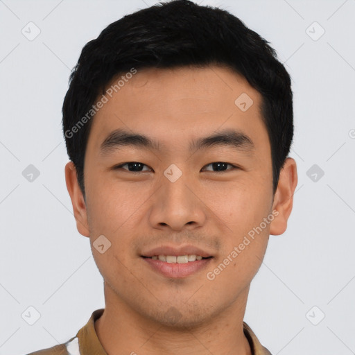 Joyful asian young-adult male with short  black hair and brown eyes