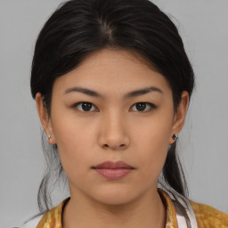 Neutral asian young-adult female with medium  brown hair and brown eyes