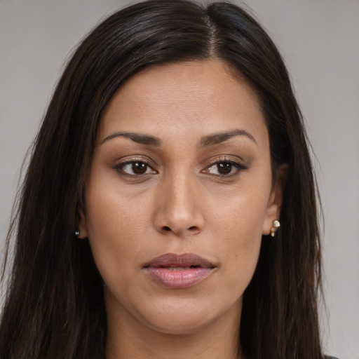 Joyful asian young-adult female with long  brown hair and brown eyes