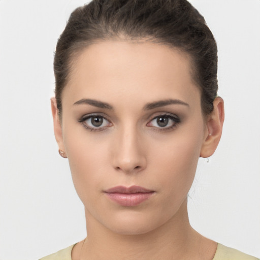 Neutral white young-adult female with short  brown hair and brown eyes