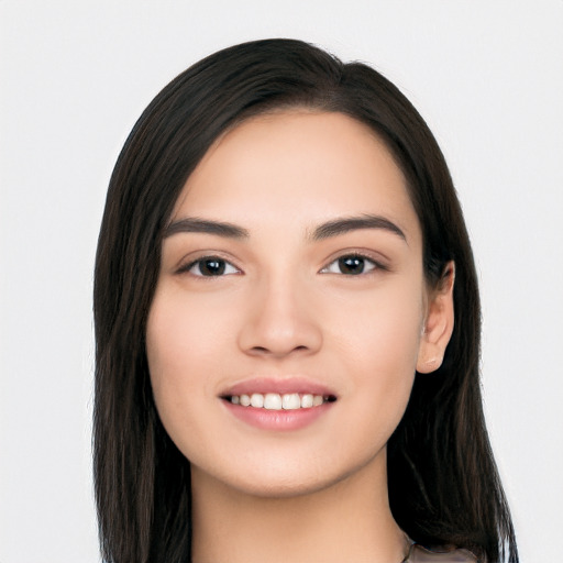 Joyful white young-adult female with long  black hair and brown eyes