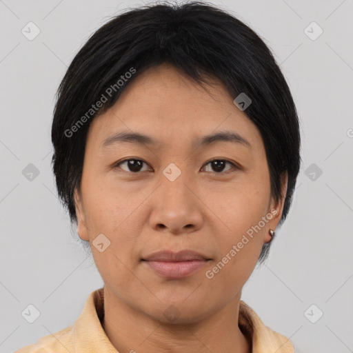 Joyful asian young-adult female with short  brown hair and brown eyes