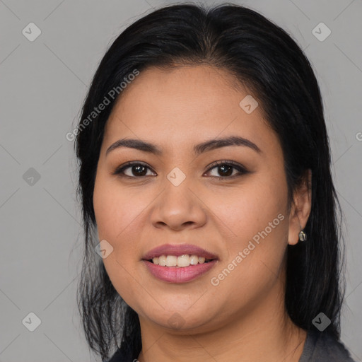 Joyful latino young-adult female with long  black hair and brown eyes