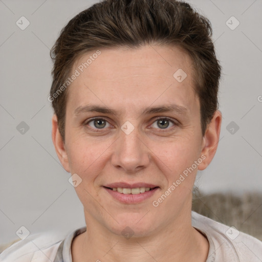 Joyful white adult female with short  brown hair and grey eyes