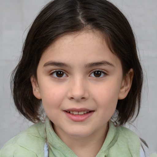 Joyful white child female with medium  brown hair and brown eyes