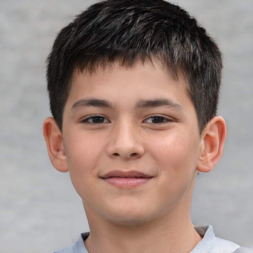 Joyful white child male with short  brown hair and brown eyes