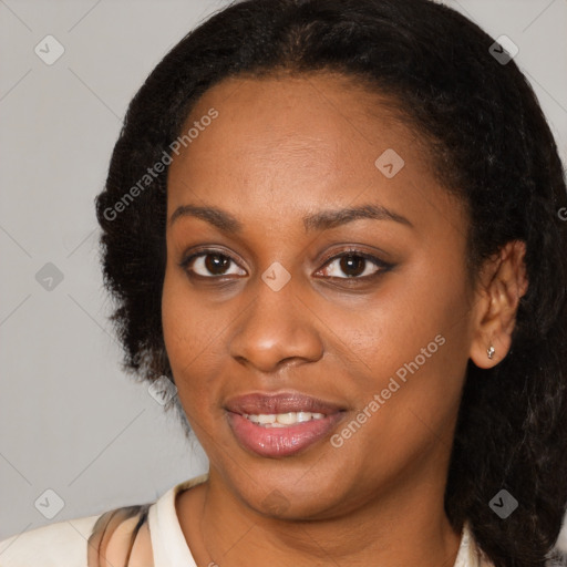 Joyful black young-adult female with medium  brown hair and brown eyes