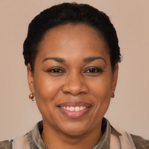 Joyful latino adult female with short  black hair and brown eyes