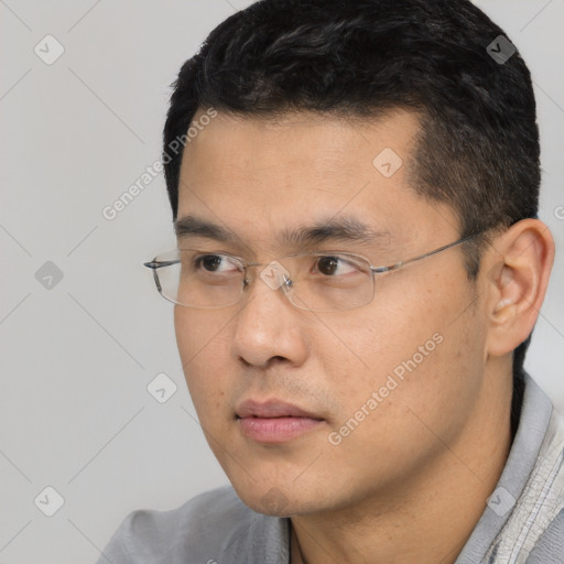 Neutral white young-adult male with short  black hair and brown eyes