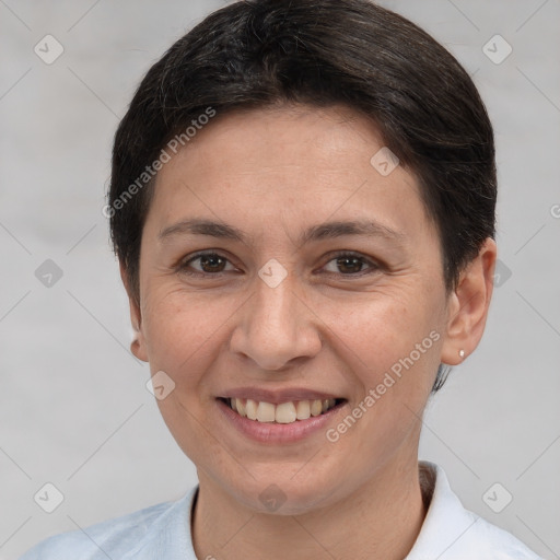 Joyful white adult female with short  brown hair and brown eyes