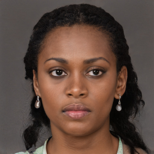 Neutral black young-adult female with long  black hair and brown eyes