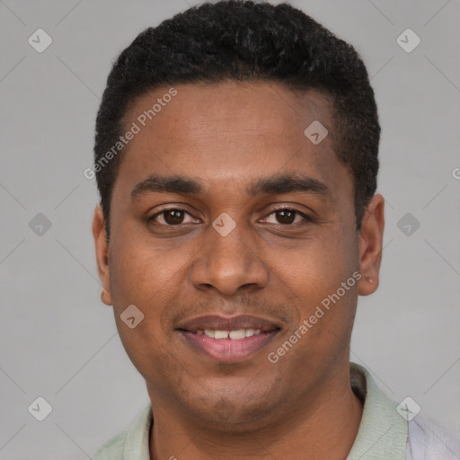 Joyful black young-adult male with short  black hair and brown eyes