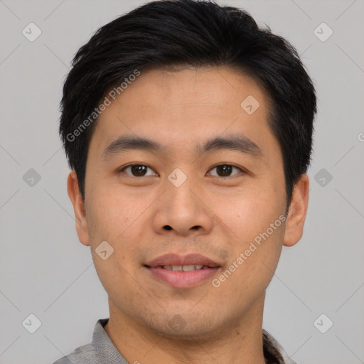 Joyful asian young-adult male with short  black hair and brown eyes